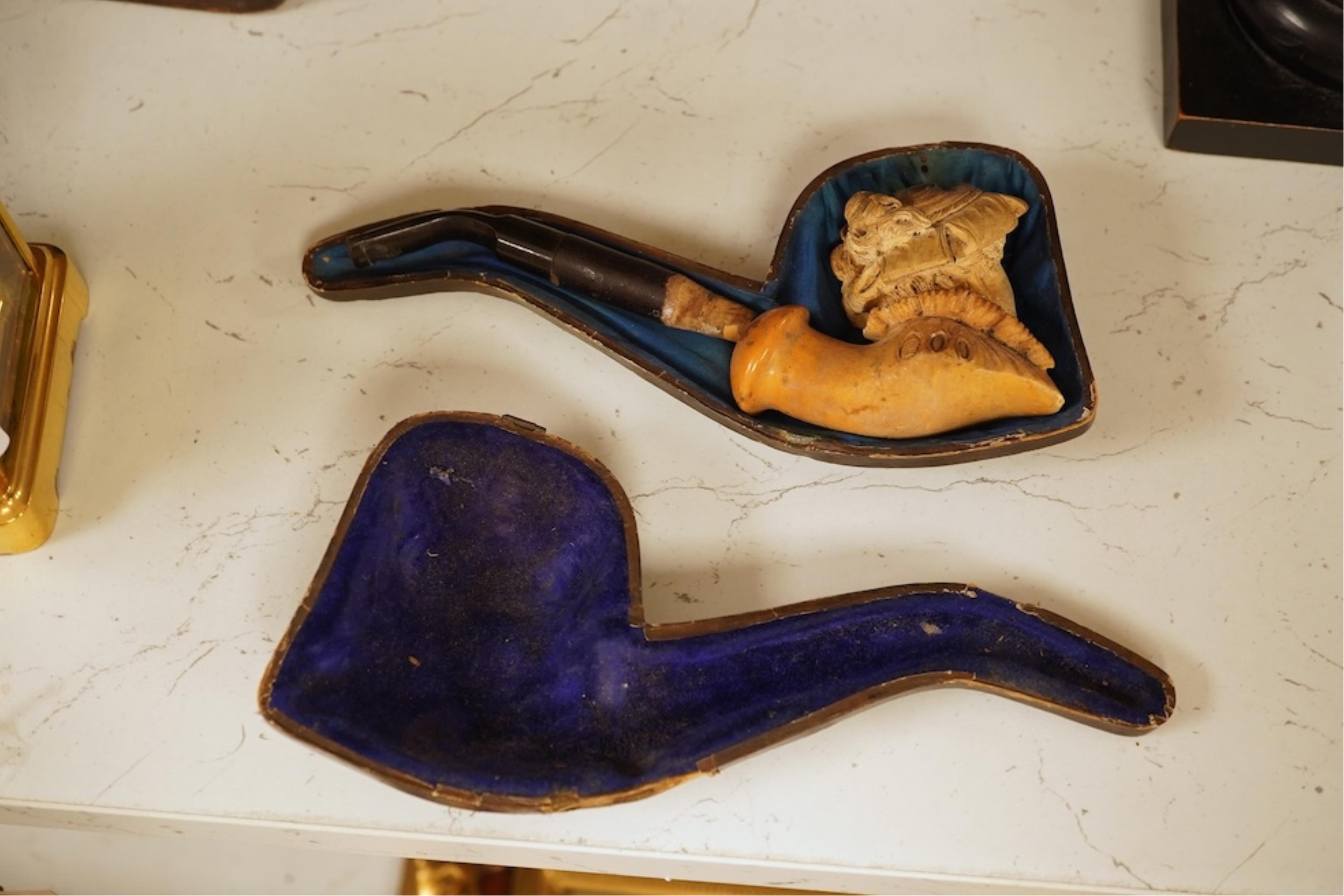 A 19th century German cold-painted terracotta bust, on ebonised socle and a Meerschaum pipe in case, bust 27cm high
